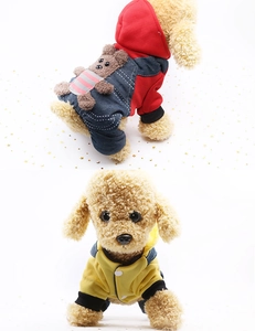 Detail of hooded pet jumpsuit with denim pants and 3D plush bear decoration