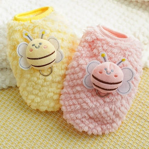 Close-up of plush pet vest with bee decor and metal D-ring for leash attachment