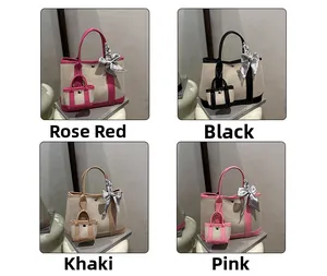 Contrast color bucket bags in rose, black, khaki, and pink with silk ribbon charms