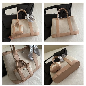 Detail view of beige canvas and khaki leather tote bag with silk scarf and mini pouch