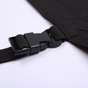 Detail of durable black plastic buckle and nylon strap on dog waterproof raincoat