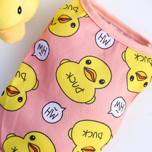 Close-up of breathable pink mesh pet vest with cute yellow cartoon duck print