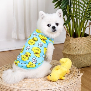 Close-up of sky blue mesh dog vest with yellow duck print and breathable texture