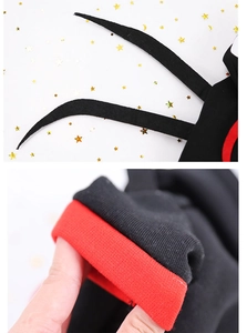 Detailed macro view of the black and red knitted fabric on the pet spider hoodie