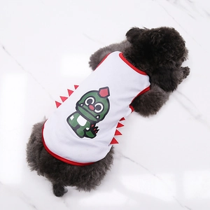 Detail of white mesh pet vest with cartoon green dinosaur print on a black poodle