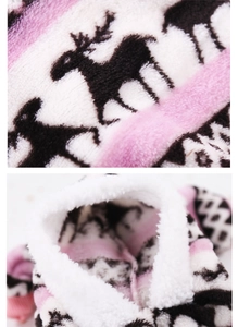 Detail of coral fleece pet clothes with reindeer print and warm sherpa lining texture