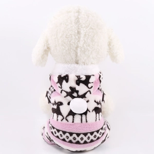 Detail of pink coral fleece pet hoodie with brown reindeer motifs and plush white pom-pom
