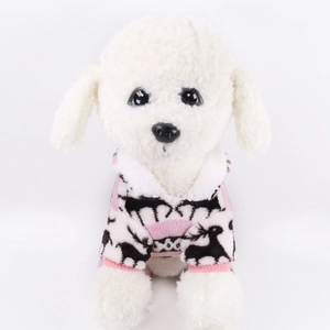 Detail of soft winter coral fleece pet sweater with festive reindeer patterns and stripes