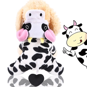 Detailed view of plush cow-patterned pet costume with soft 3D hood and heart tail