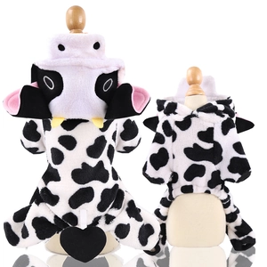 Detail view of cow-print pet jumpsuit with plush flannel hood and 3D decorative ears