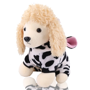 Detail of soft coral fleece dog costume with black and white cow pattern and curly plush texture