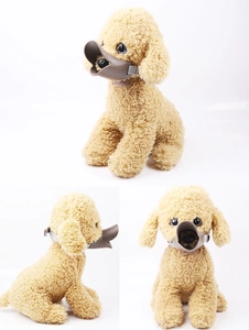 Detail view of the brown duckbill dog muzzle with adjustable strap on a plush toy dog