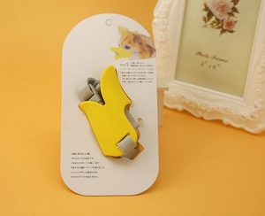 Detail of yellow duckbill dog muzzle size S with adjustable strap and retail packaging