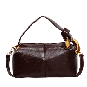 Sac polochon rétro en cuir huilé marron foncé avec chaîne dorée et bandoulière