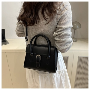 Classic black leather-textured crossbody bag with silver buckle and elegant handles