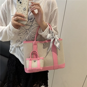 Beige canvas and pink leather contrast tote bag with mini charm and silk scarf handle