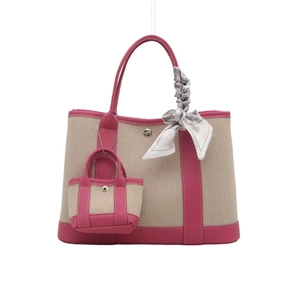 Canvas bucket bag in beige weave with magenta leather trim and decorative scarf detail