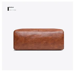 Detailed bottom view of brown leather tote bag with vintage texture and neat stitching