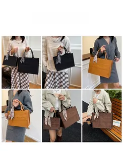 Retro tote bag featuring frosted texture, embossed lettering and elegant scarf detail