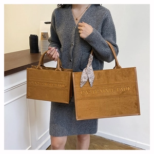 Comparison of large and small brown frosted leather tote bags with silk scarf detail