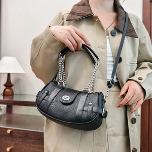 Chic black lychee grain leather handbag with silver chain and adjustable shoulder strap