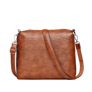 Three-piece fashion faux leather tote bag in caramel brown with adjustable strap