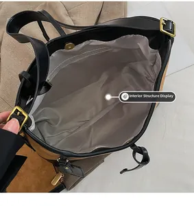 Top view of two-tone tote bag interior featuring gray lining and a zippered pocket