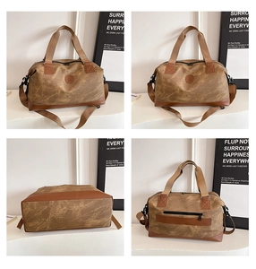 Detail view of large travel duffel bag with leather trim and multiple functional pockets