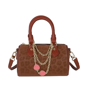 Vintage leopard print Boston handbag with gold chains and strawberry charms in brown