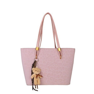 Pink leopard embossed tote bag with rope handles and cute plush bear charm for women