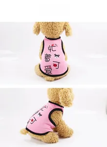 Detail view of pink dog vest with cartoon pig print and black trim on model