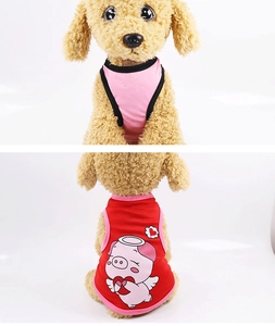 Close-up of pink and red pet vest featuring a cute cartoon pig print with heart patterns