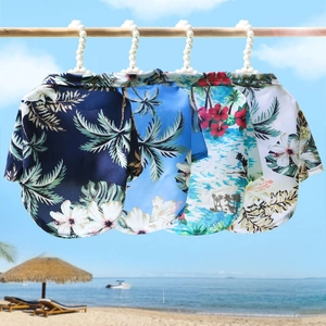 Hawaiian style dog shirts in four tropical prints with pearl hangers for summer