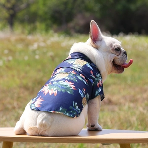 Detail of tropical pineapple print on dark blue summer pet shirt for small dogs