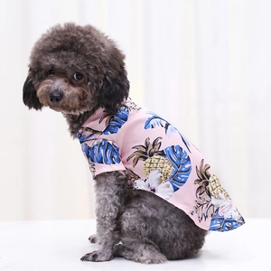 Lightweight pink pet shirt with pineapple tropical print on a small grey poodle dog
