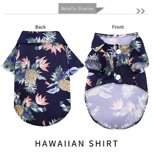 Hawaiian pet dog shirt with pineapple print in dark blue, front and back flat lay view
