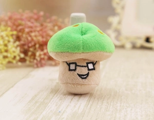 Detailed embroidery on green mushroom plush toy with cute glasses and smile face