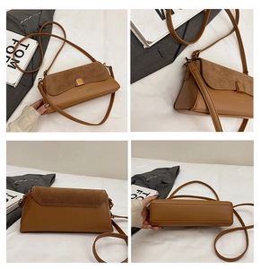 Detail view of brown contrast baguette bag with suede flap and gold metal buckle