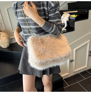 Detail of soft faux fur tote bag in apricot with elegant gold metal chain strap