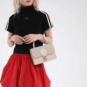 Elegant beige crossbody satchel bag with metallic buckle shown in a side view