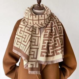 Winter faux cashmere scarf featuring a brown geometric labyrinth pattern with fringe