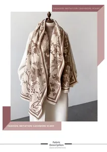 Detail of floral printed cashmere scarf with soft fringes on elegant vintage shawl