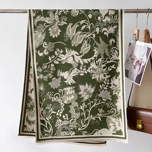 Close-up of vintage floral jacquard shawl with fine tassels and elegant drape