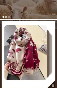 Detail of burgundy and beige floral scarf with fringe edges and thick wool-like texture