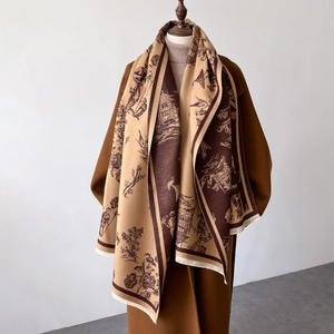 Detail of brown Toile de Jouy cashmere pashmina shawl with tassel fringe and vintage pattern