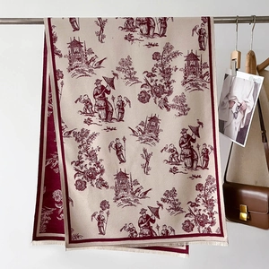 Detail of soft cream pashmina with burgundy toile de jouy print and fine tassels