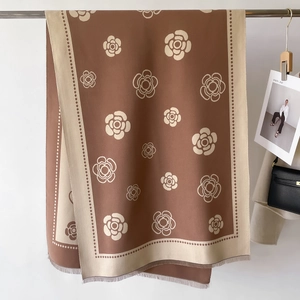 Detail of camellia pattern on a dual-sided cashmere-like scarf with fringe edges