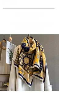 Detail of soft paisley patterns and fine fringes on a thick cashmere-like scarf