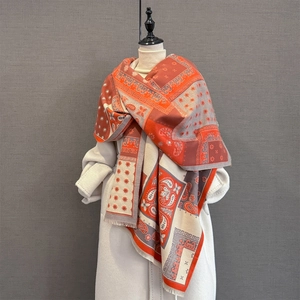 Detail of bohemian paisley and geometric pattern on thick cashmere-feel shawl with fringe