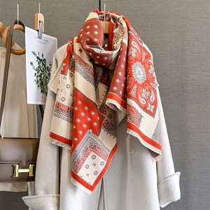 Contrast paisley cashmere scarf with red and white patterns and fringe tassels